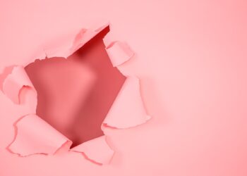 The background is pink with a hole for advertisement
